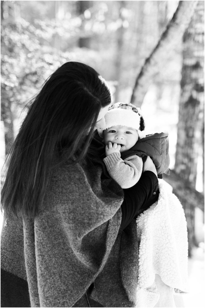 Black and white photo of mom hugging baby