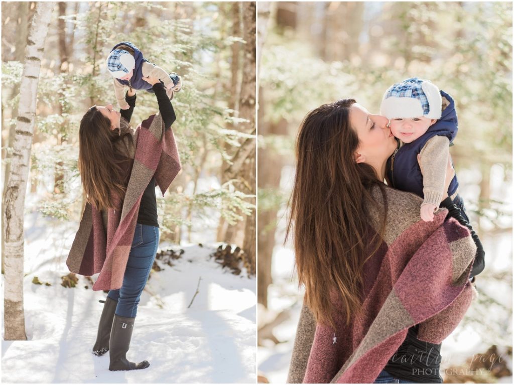 Mom kissing baby in the snow