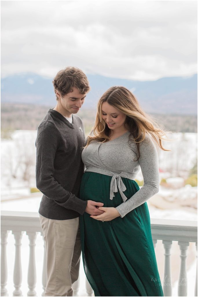 Husband and wife looking at pregnant belly