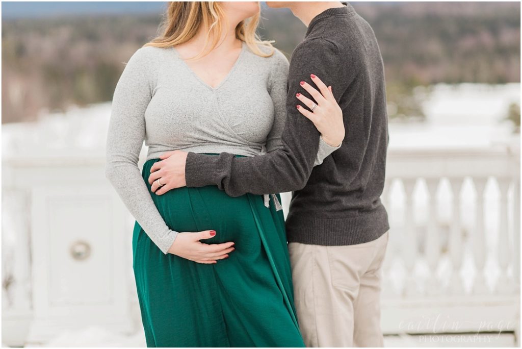 Couple holding baby belly