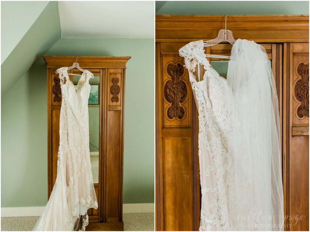 Blush wedding dress hanging on armoire