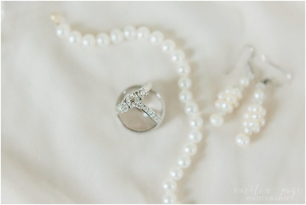 Wedding rings, earrings and pearl bracelet