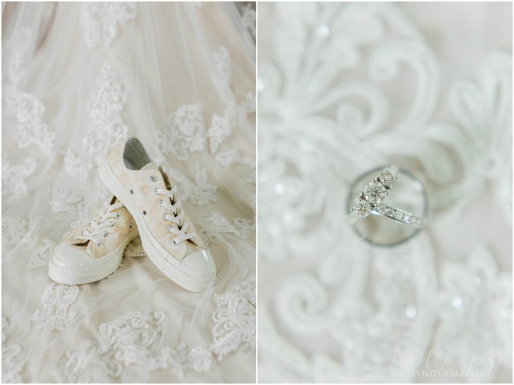 Converse wedding sneakers and wedding rings on dress train