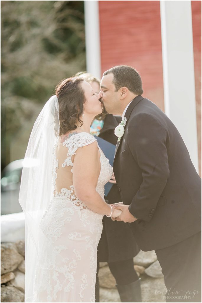 Bride and groom kissing at end of ceremony