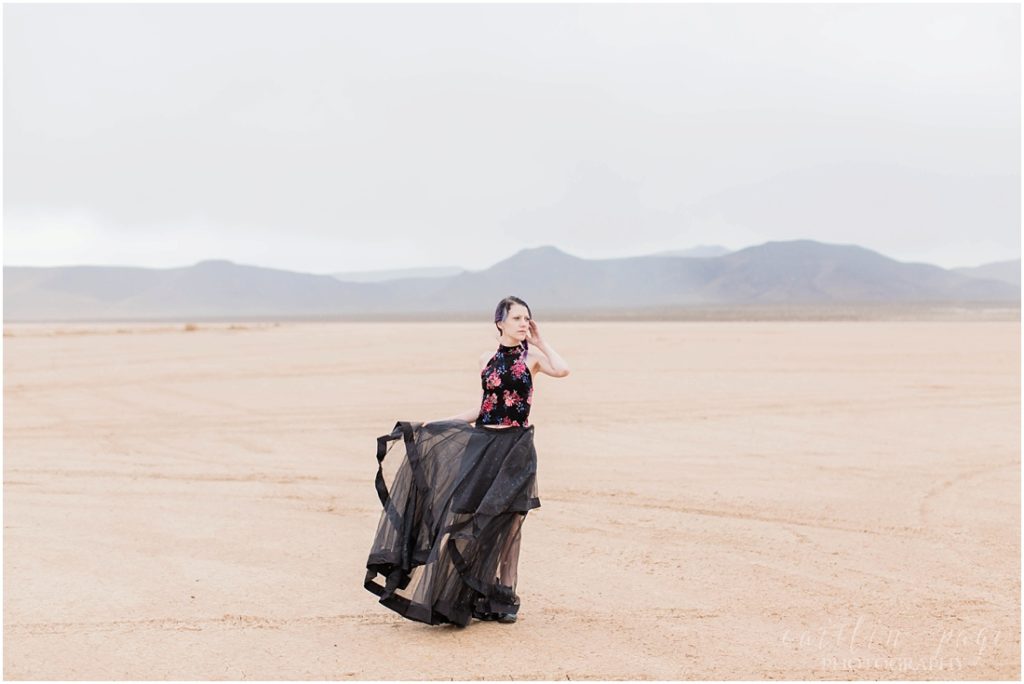 Girl in black skirt in desert