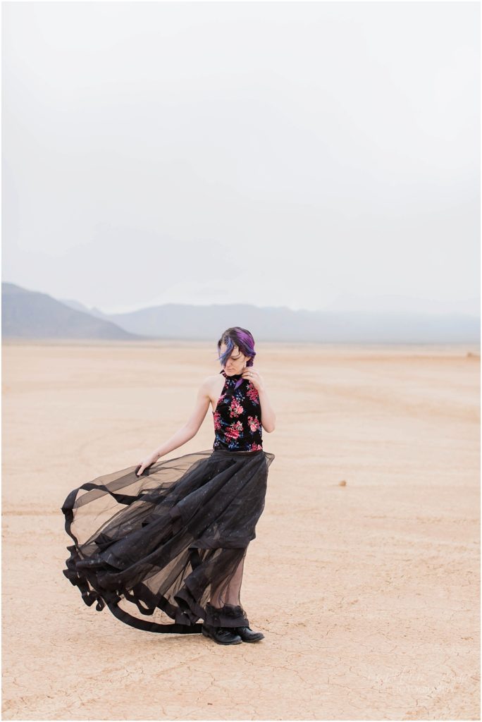 Model with purple hair and black skirt