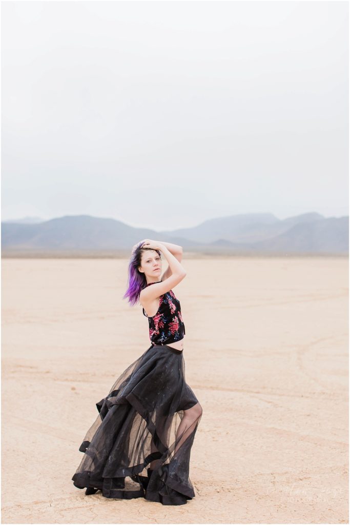 Model with black skirt in desert