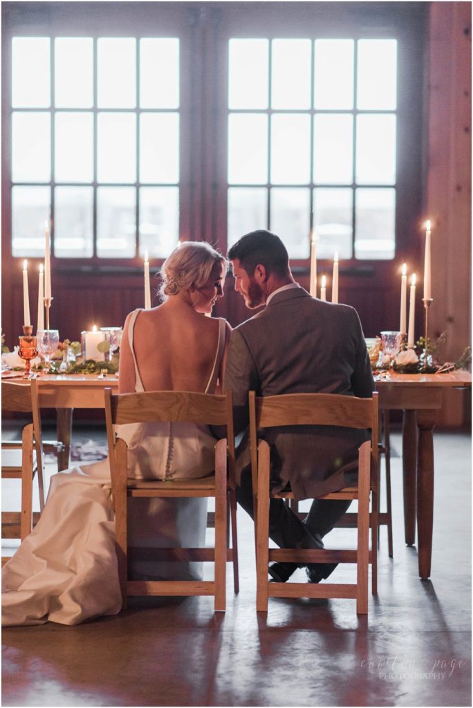 bride-and-groom-seated-at-head-table