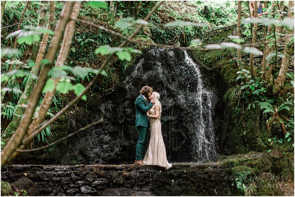 bride and groom at irish waterfall