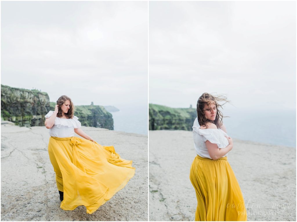girl in yellow skirt on cliffs of moher