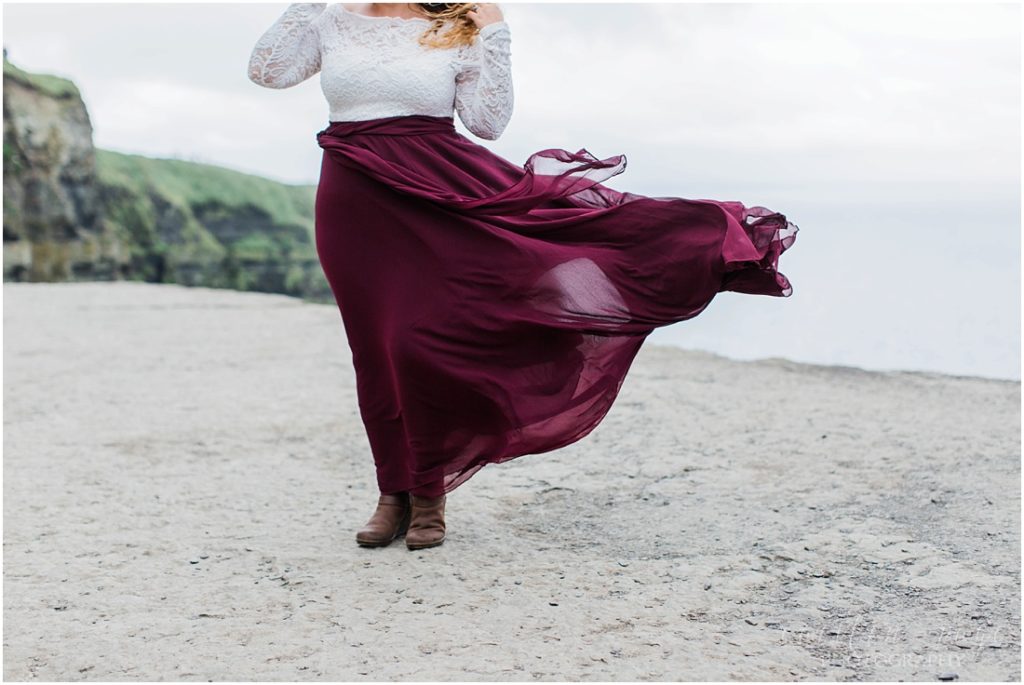 maroon skirt on cliffs of moher
