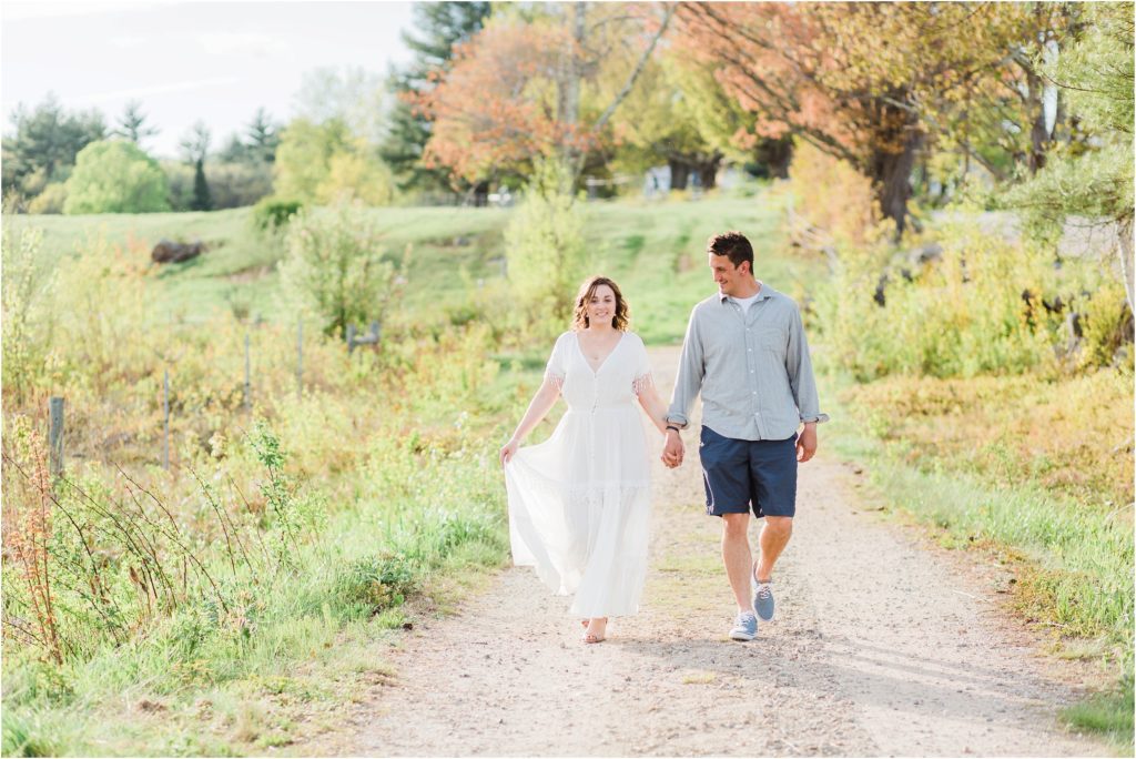 bride and groom walking field