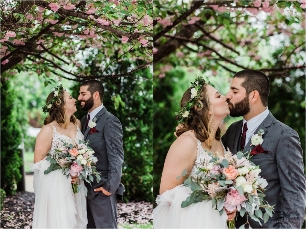 bride and groom under cherry tree
