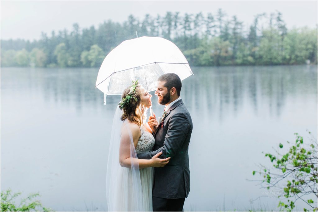 bride and groom with umbrella
