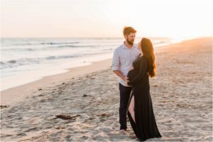 pregnant couple at beach