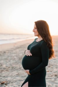 pregnant woman with long sleeved dress