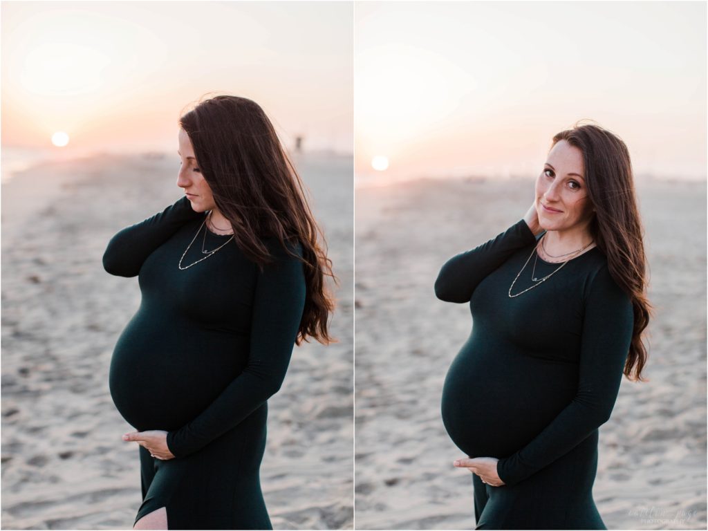 pregnant woman holding belly looking at camera
