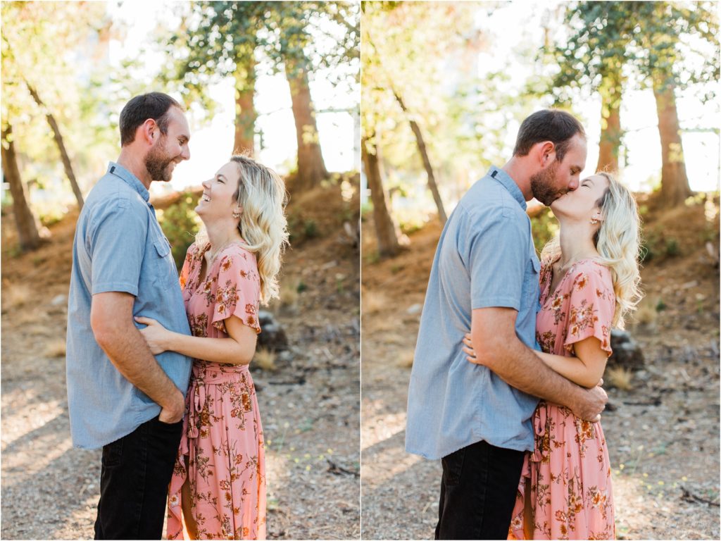 man and woman kissing engagement photos