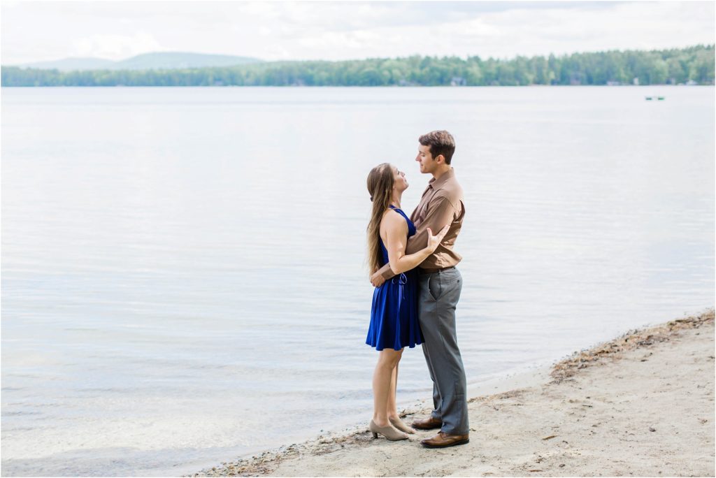 couple standing at waters edge