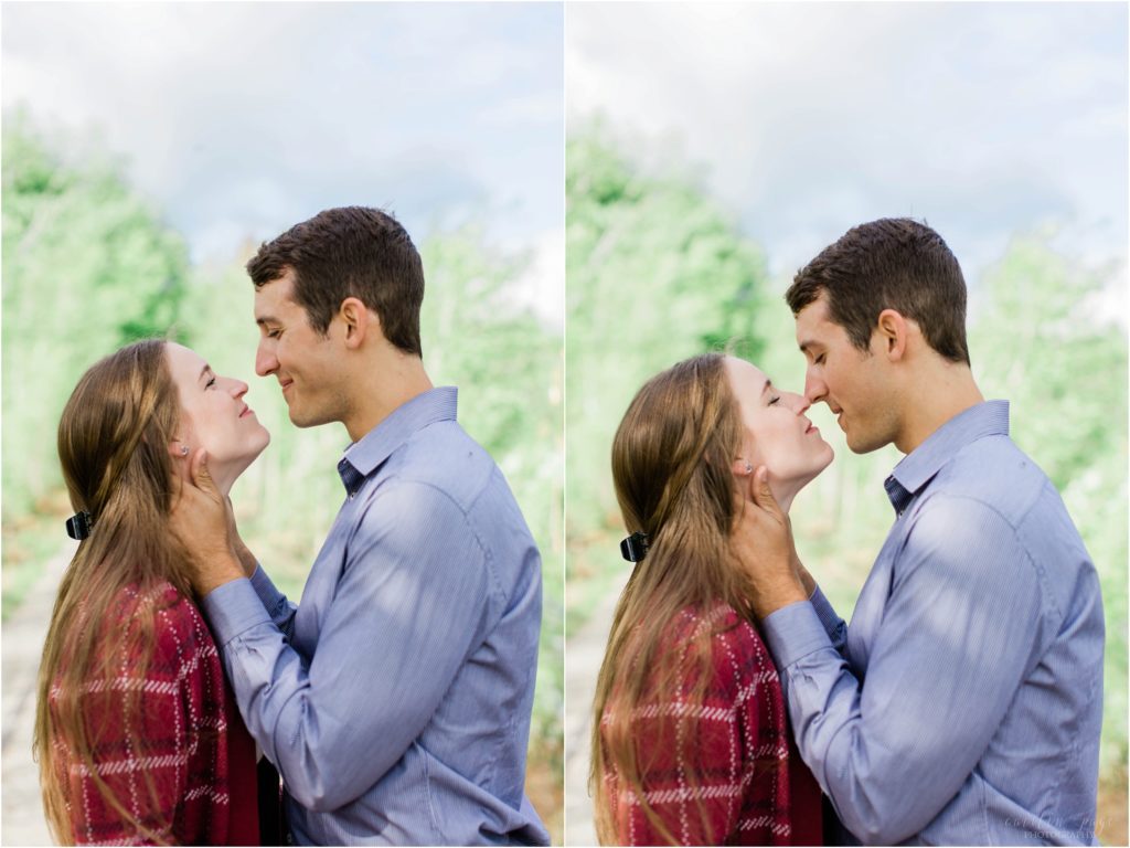 couple kissing by trees