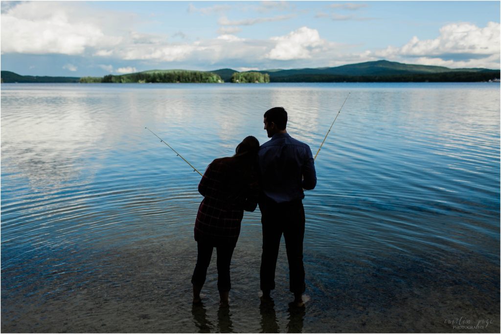 man and woman fishing in lake silhouette