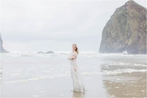 woman standing on cannon beach oregon