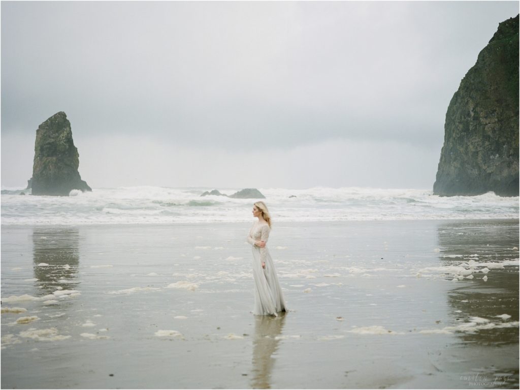 woman looking off cannon beach oregon