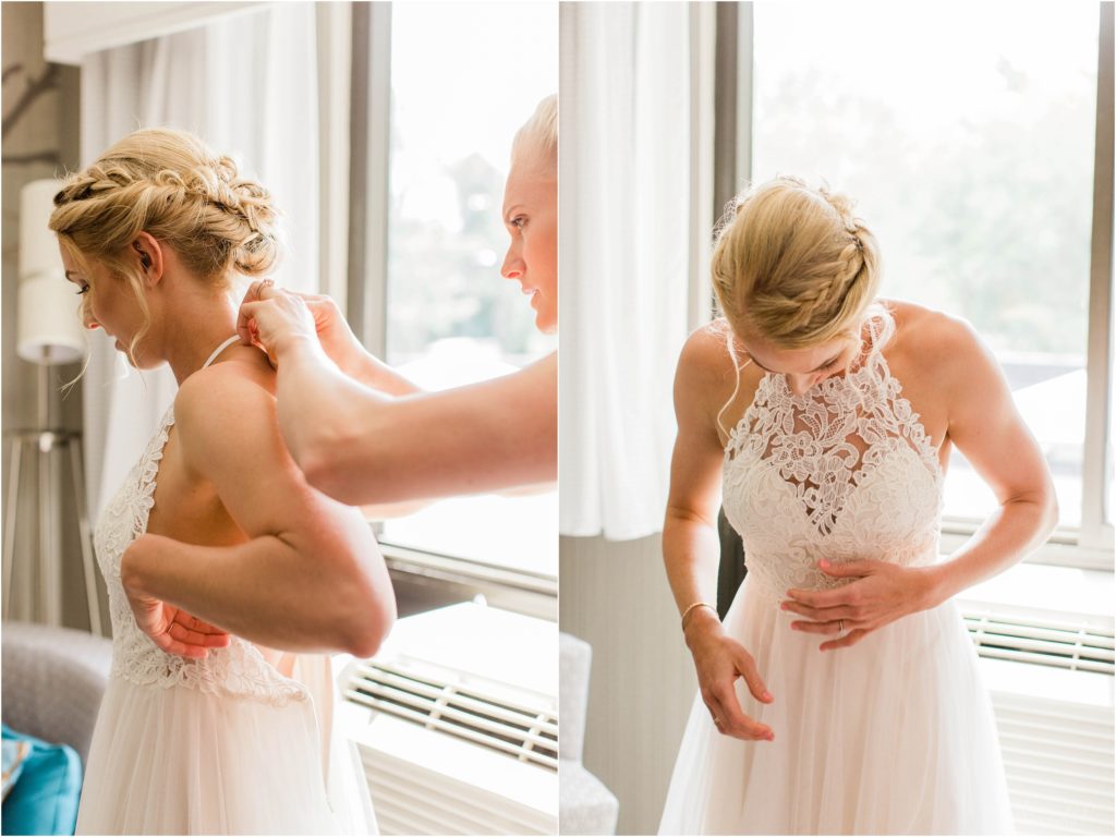 bride getting zipped into dress