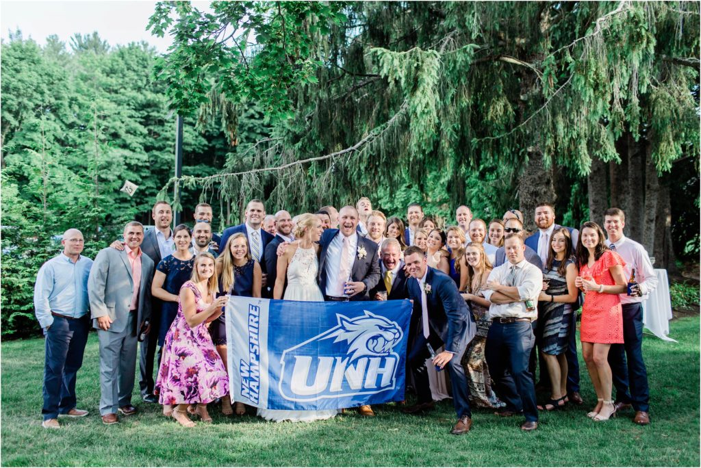 unh grads with flag at wedding