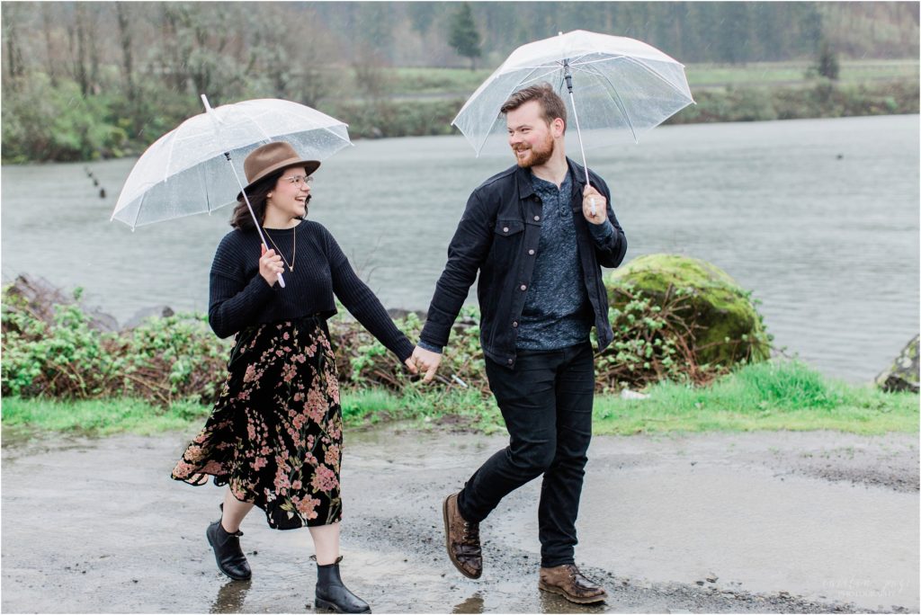 couple walking together in rain oregon