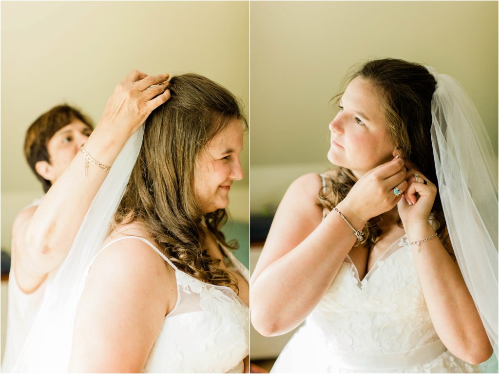 bride putting veil and earrings on