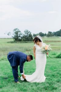 brother of bride straightening her dress
