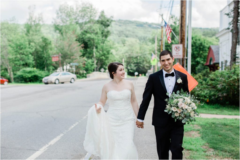 bride and groom walking downtown jackson new hampshire