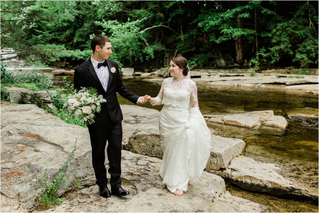bride and groom walking at jackson falls