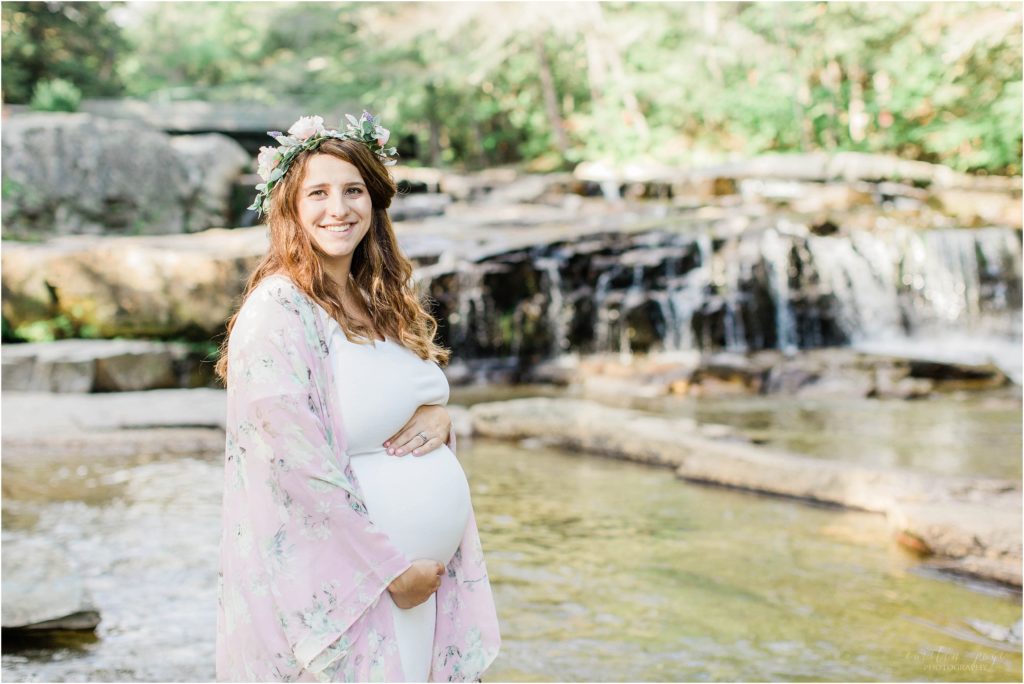 pregnant woman standing at jackson falls