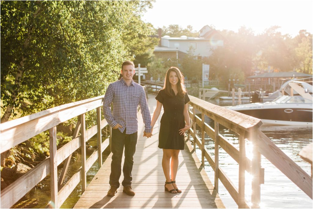 couple standing on walkway church landing engagement session meredith nh