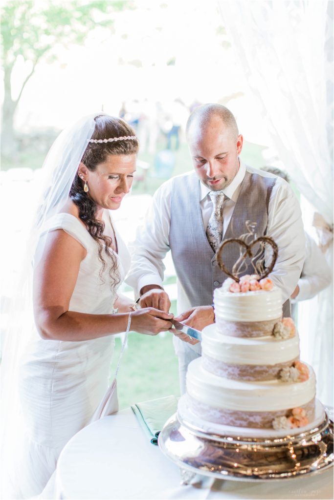bride and groom cutting wedding cake moody mountain farm