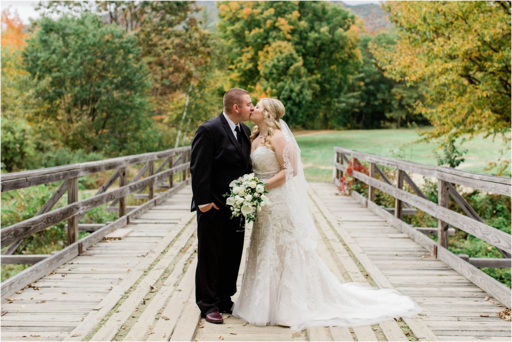 bride and groom on bridge jackson new hampshire