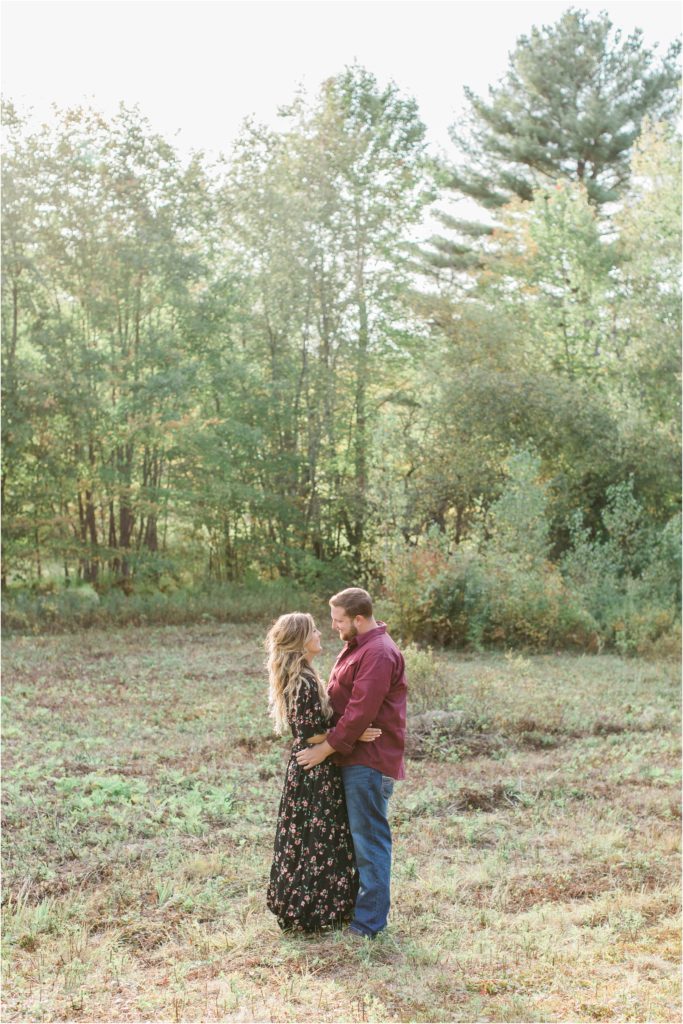 couple in field engagement session new hampshire
