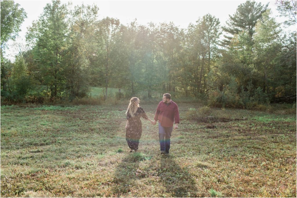 couple walking in field engagement