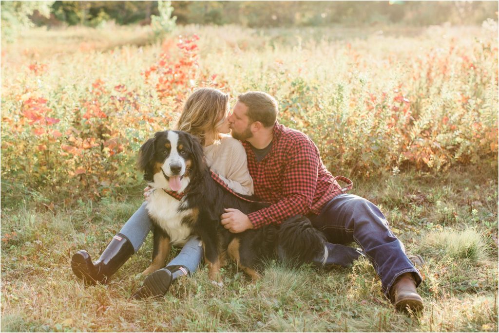 couple kissing with dog effingham engagement session