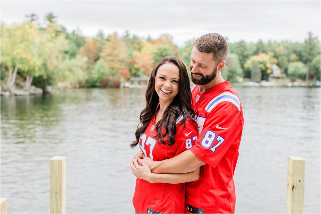 couple with patriots jerseys lake winnipesaukee