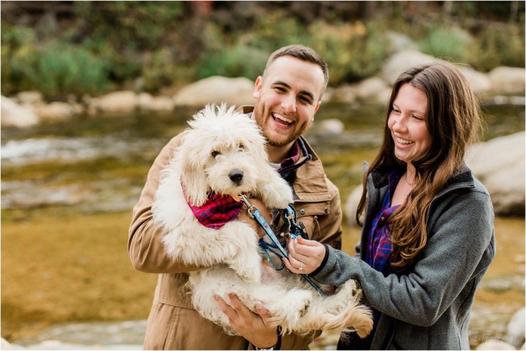 couple playing with puppy at lower falls