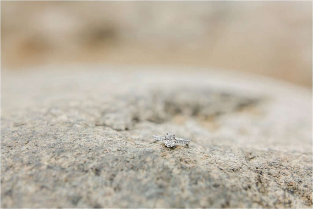 engagement ring on granite rock