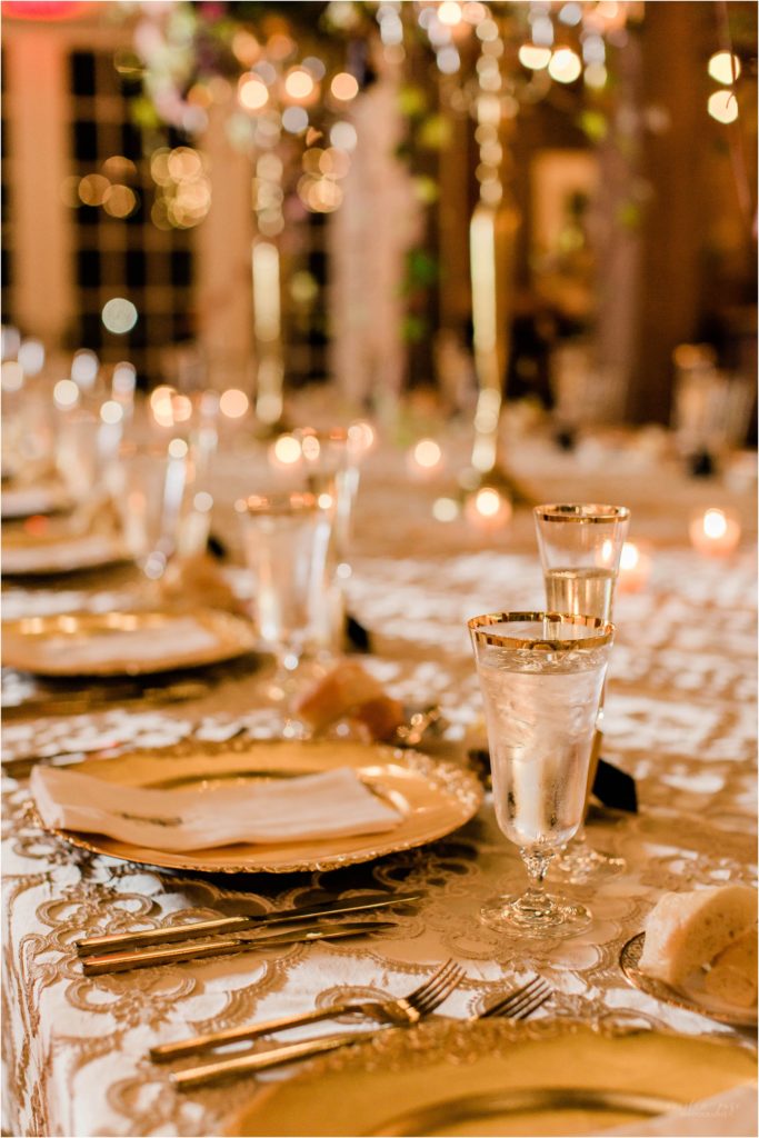 gold rimmed glasses table setting