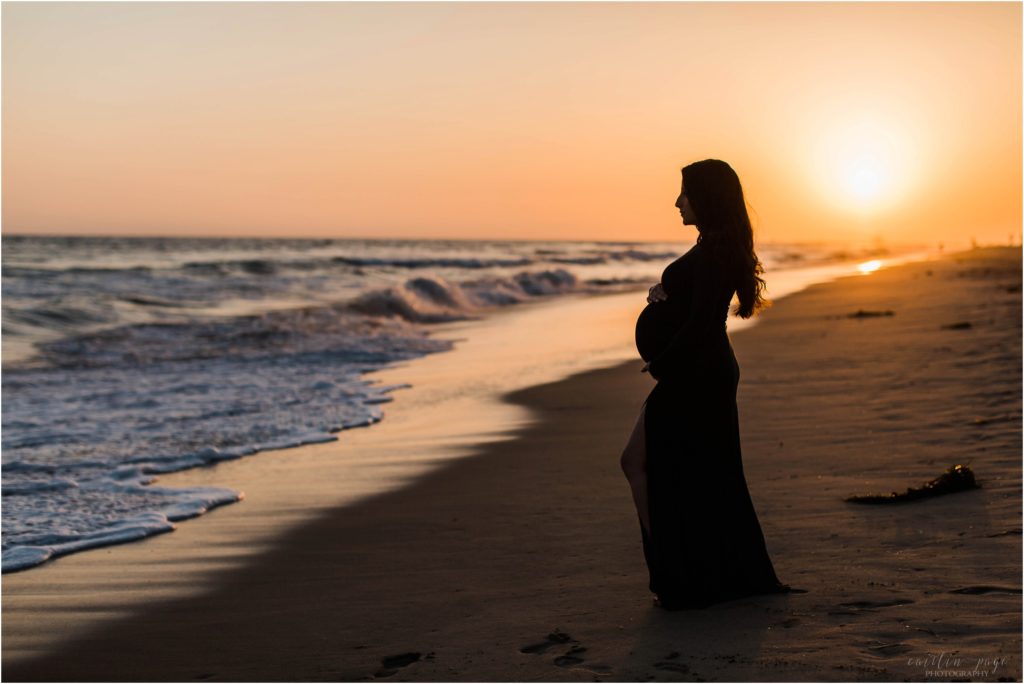 silhouette of pregnant woman at sunset