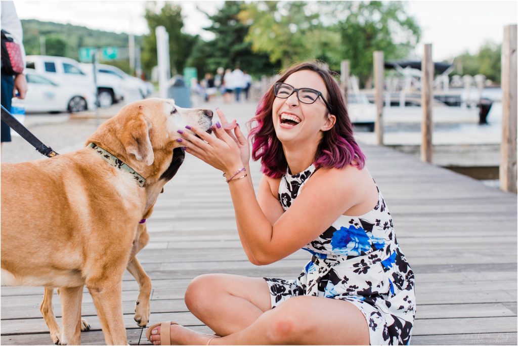 senior girl with dogs laughing