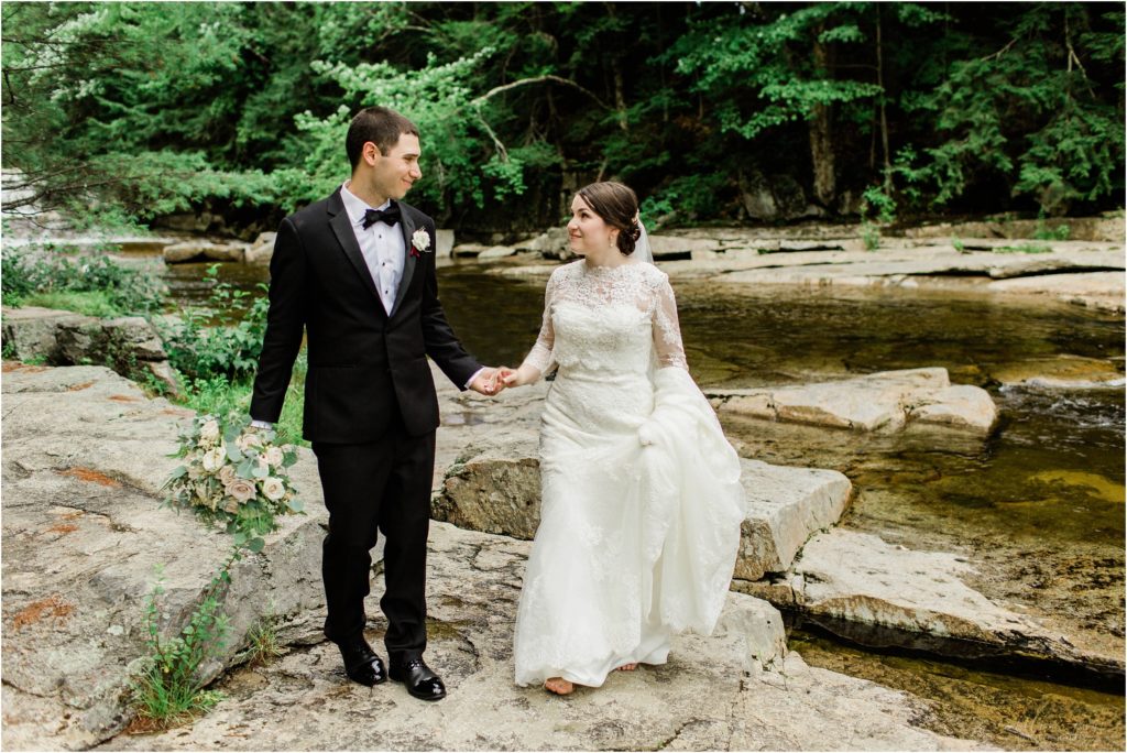 bride and groom walking jackson falls