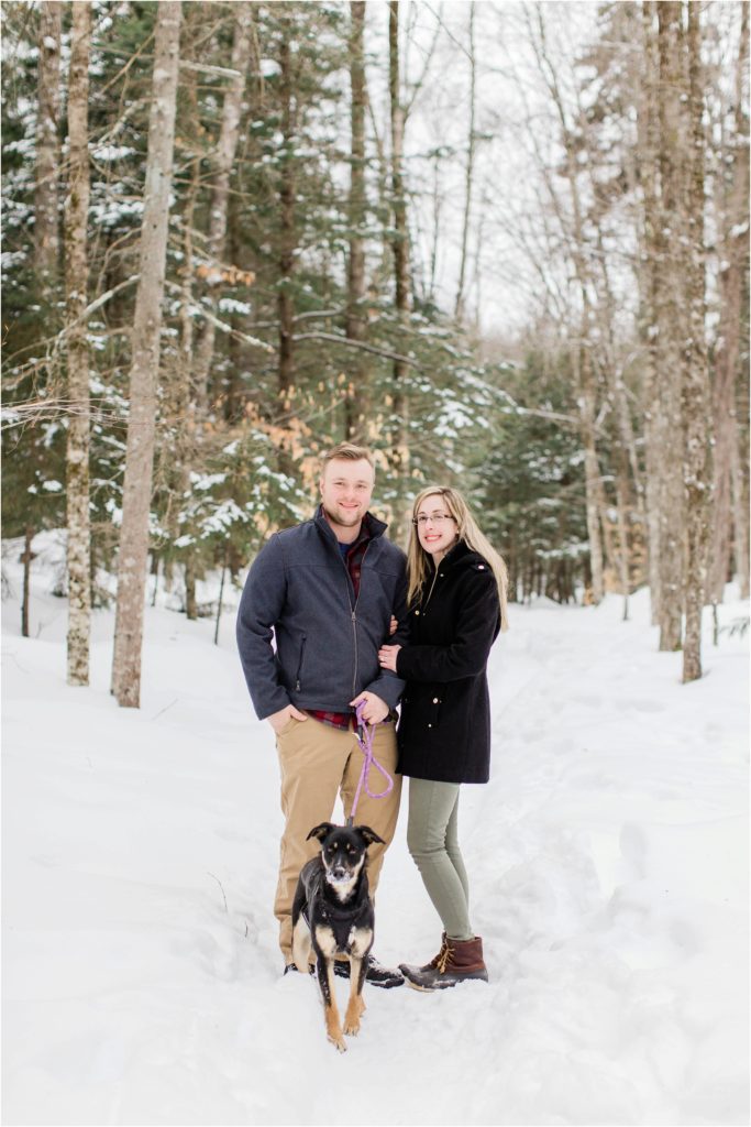 couple holding dog snow sabbaday falls