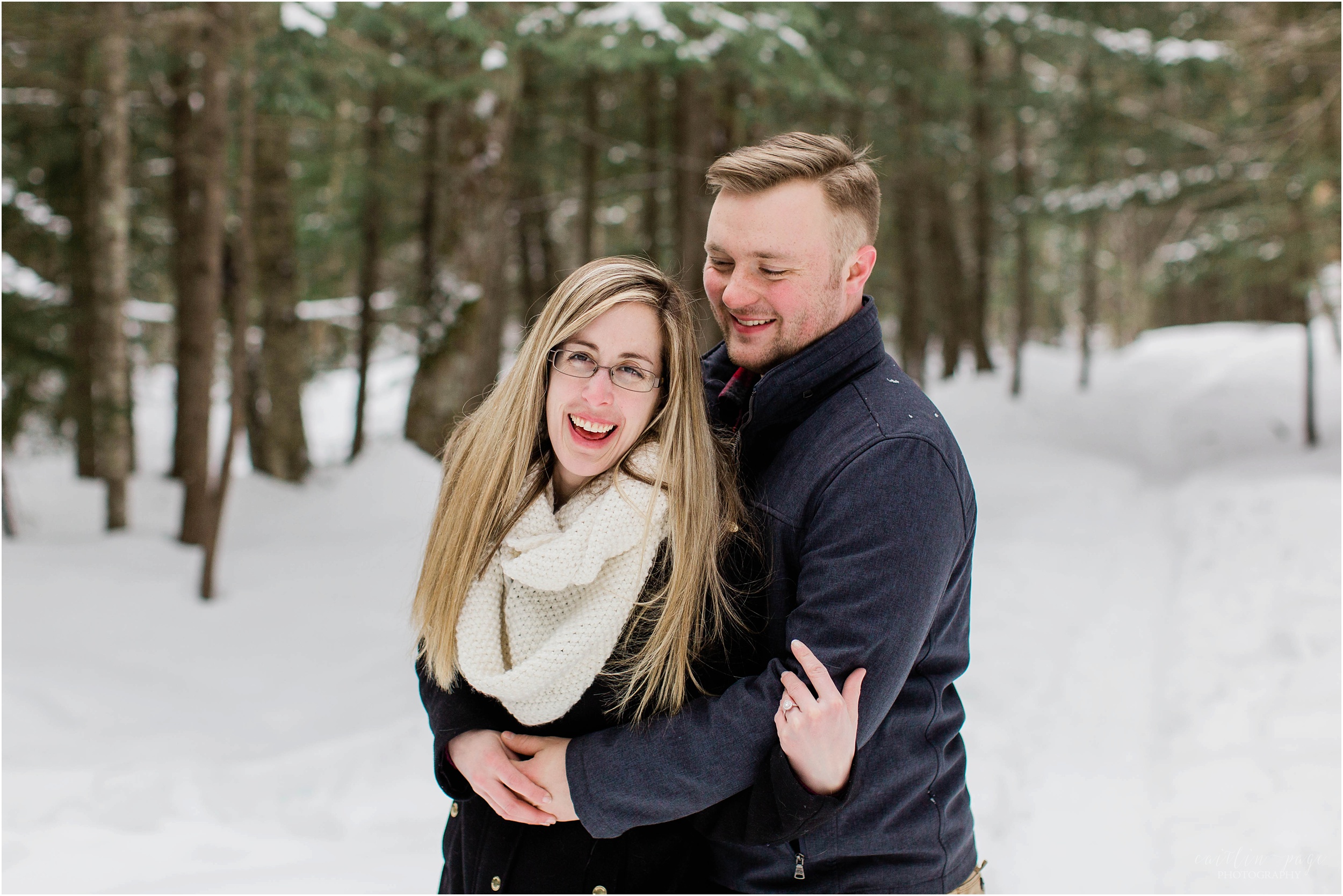 couple laughing snow